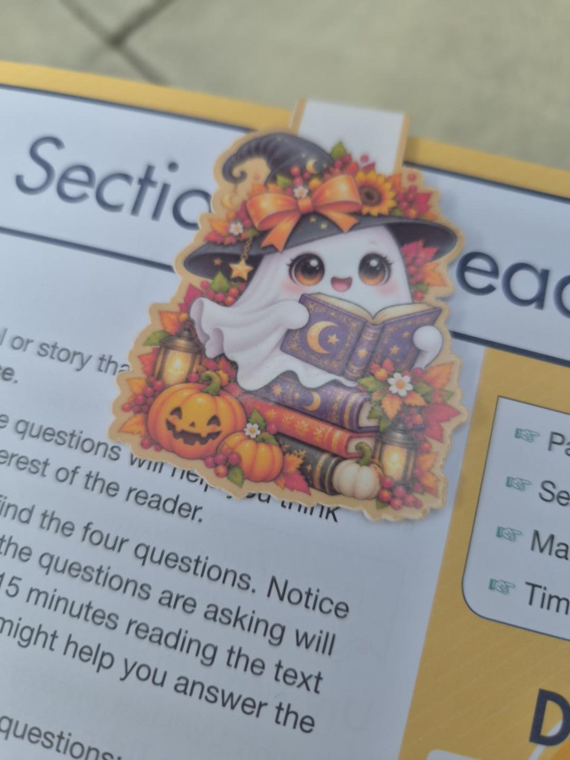 Cute Halloween ghost magnetic bookmark reading a book with pumpkins and autumn leaves